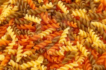 Colorful pasta as a background.