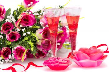 Flowers, red ribbon, two glasses, candles isolated on white background.