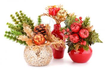 Christmas decoration in vases isolated on white background.