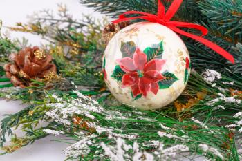 Christmas decoration with colorful ball and fir-tree branch.
