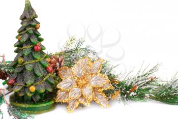 Fir tree candle and yellow flower on white background.