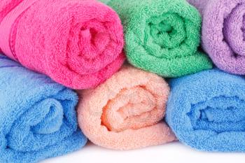 Colorful rolled towels closeup picture.