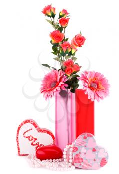 Flowers, red heart candle, necklaces, gift boxes isolated on white background.