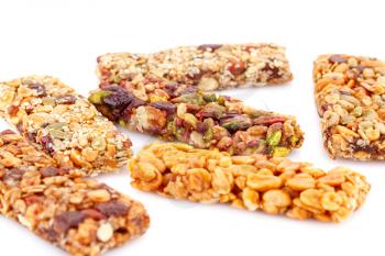 Muesli bars with different nuts isolated on white background.