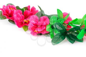 Pink fabric flowers isolated on white background.