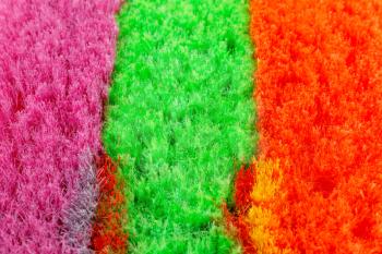 Colorful brooms closeup picture.