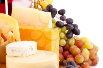 Various type of cheese,wines and grapes closeup picture.