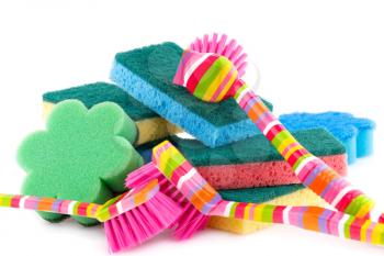 Colorful sponges and brushes isolated on white background.