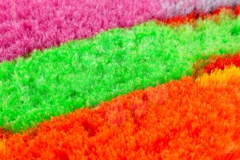 Colorful brooms closeup picture.