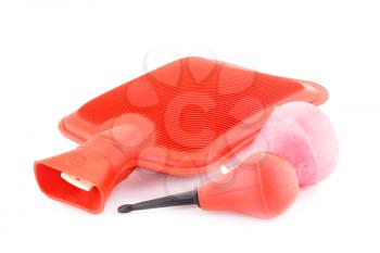 Red rubber hotty and enemas isolated on white background.