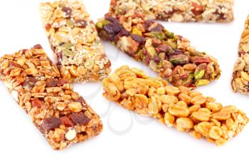 Muesli bars with different nuts isolated on white background.