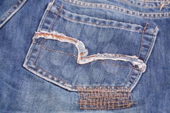 Blue jeans pocket closeup picture.