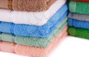 Colorful towels stacks closeup picture.
