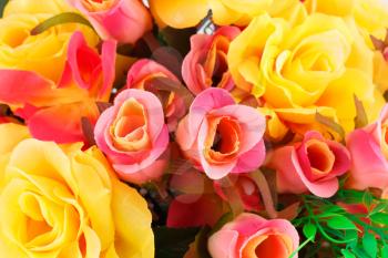Colorful fabric roses closeup picture.
