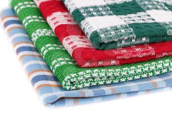 Colorful kitchen towels on white background.