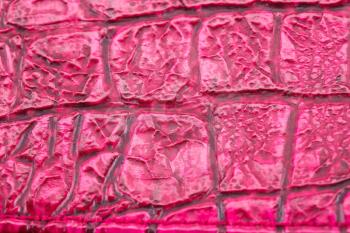 Pink leather background closeup picture.