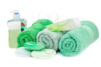 Spa set with towels, cream, lotion and soaps isolated on white background.