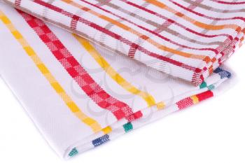 Colorful kitchen towels on white background.