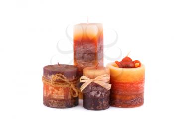 Four colorful candles isolated on white background.