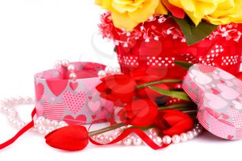 Colorful flowers, candles and gift box close up picture.