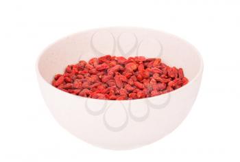 Goji berries in bamboo bowl isolated on white background.