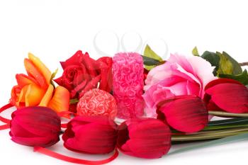 Candles, tulips and roses  isolated on white background.