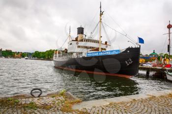 Black ship at harbor of Djurgarden in Stockholm, Sweden.