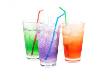 Plastic glasses with water, ice cubes and straw isolated on white background.