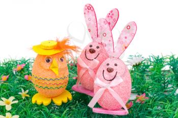 Easter egg and bunnies decoration on artificial grass.