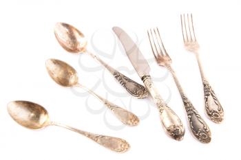Vintage spoons, knife and forks isolated on white background.