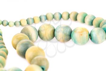 Necklace with wooden beads isolated on white background.