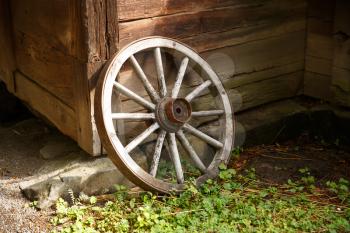 Old wheel at the traditional Sweden house.