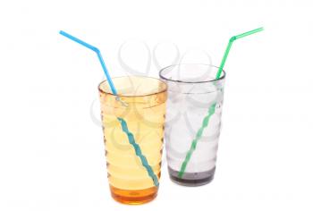 Plastic glasses with water, ice cubes and straws isolated on white background.