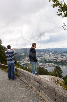 Two men on the top view point of Bergen city in Norway.