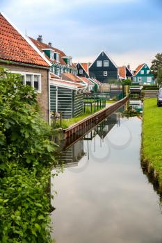The old traditional colorful houses at the canal in the Dutch fisherman village.