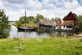 The medieval houses and boats in The Middle Ages Center, the experimental living history museum in Sundby Lolland, Denmark.