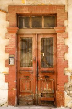 Old wooden brown door with ornament in Limassol, Cyprus.