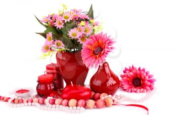 Colorful flowers, vases, candles and necklaces on white background.