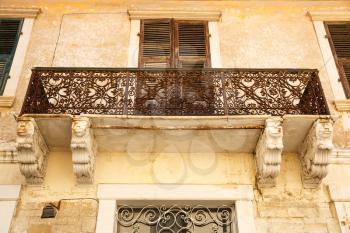 Old building with beautiful balcony in Limassol, Cyprus.