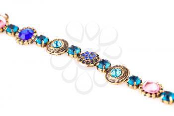 Ancient style bracelet with colorful stones isolated on a white background.