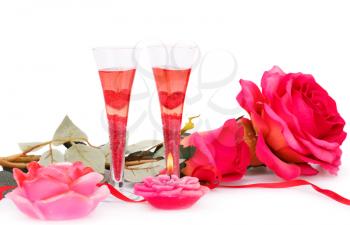 Two glasses, candles and roses  isolated on white background.