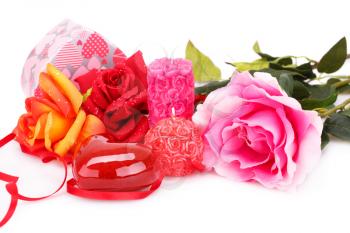 Candles, roses and gift box isolated on white background.