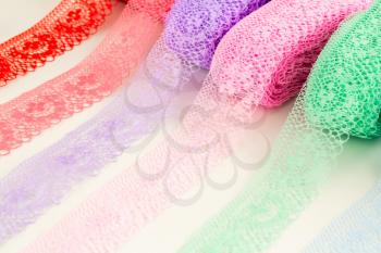 Colorful lace tapes close up picture.