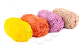 Four knitting yarn clews isolated on white background.