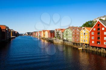 Colorful old houses at the Nidelva river embankment in Trondheim, Norway.