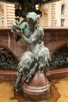 The figurine at the statue of Hygieia the goddess of health and hygiene n the courtyard of Hamburg City Hall (Rathaus), Germany.