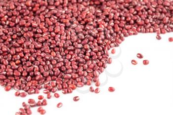 Red azuki beans on a white background.