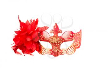 Carnival mask with red feathers and flower isolated on a white background.