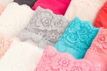 Many colorful panties close up picture.