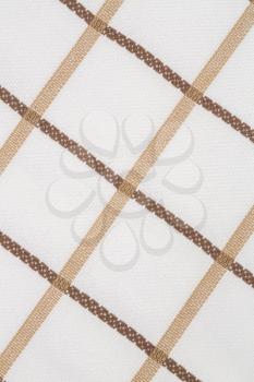 Beige and white kitchen towel texture as a background, vertical image.